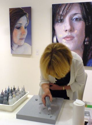 Gail Troth working on a demo canvas